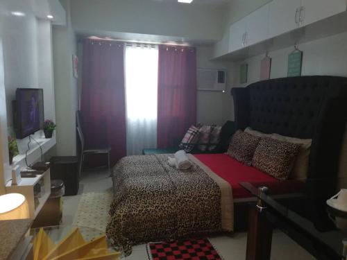 Ένα ή περισσότερα κρεβάτια σε δωμάτιο στο JDT's Condo at Horizons 101 Cebu