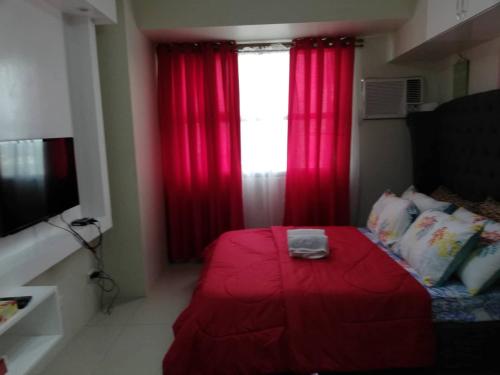 Ένα ή περισσότερα κρεβάτια σε δωμάτιο στο JDT's Condo at Horizons 101 Cebu