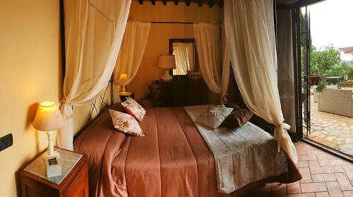 Podere Palazzolo (ADULTS ONLY) tesisinde bir odada yatak veya yataklar