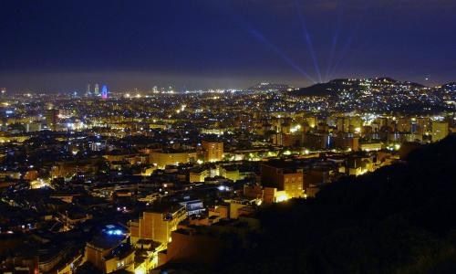 a view of a city at night with lights at BADAROSA House10min to BARCELONA City&NearTo BEACH in Badalona