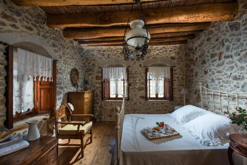 Postel nebo postele na pokoji v ubytování Arismari Houses - Arismari