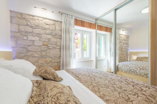 Posteľ alebo postele v izbe v ubytovaní Apartman Grgur