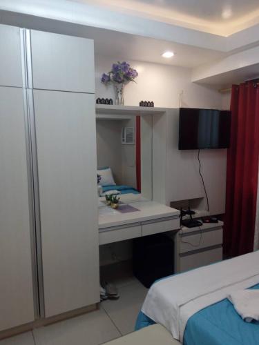 Ένα ή περισσότερα κρεβάτια σε δωμάτιο στο JDT's Condo at Horizons 101 Cebu