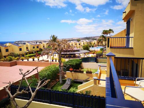 a view from the balcony of a apartment building at Bahía Meloneras in Meloneras