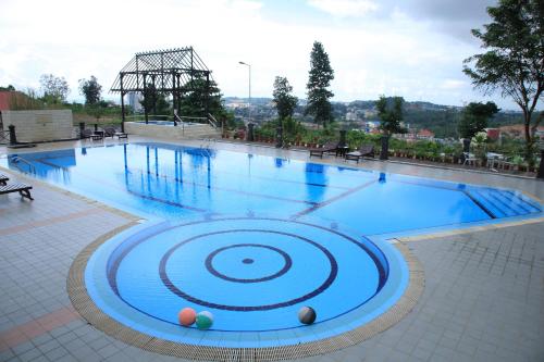 a large swimming pool with blue water at Crown Vista Hotel in Nagoya