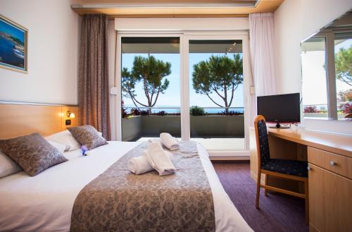 Posteľ alebo postele v izbe v ubytovaní Hotel More