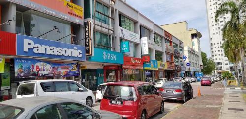 a busy city street filled with lots of cars at Strait Garden Suites X Ace Pro @ George Town in Jelutong