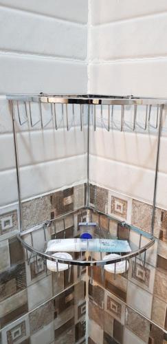 a ceiling with a glass shelf in a room at Jasmine Beach Hotel Suites in Yanbu