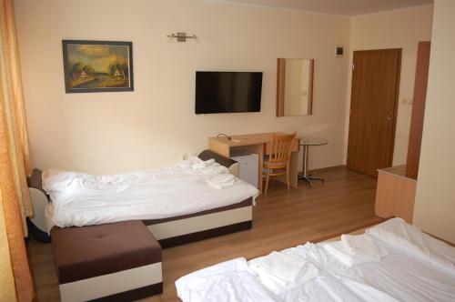 Ένα ή περισσότερα κρεβάτια σε δωμάτιο στο Hotel Vitosha