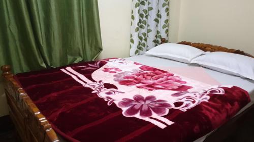 Ένα ή περισσότερα κρεβάτια σε δωμάτιο στο Mahakal homestay