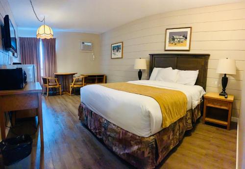 Postel nebo postele na pokoji v ubytování Armstrong Inn
