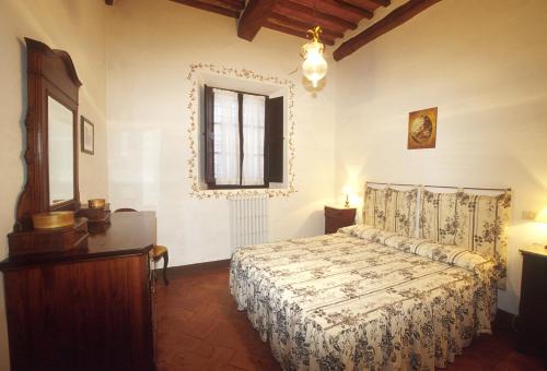 Tempat tidur dalam kamar di Agriturismo Fattoria Di Corsano