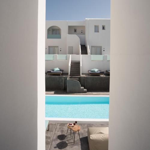 a view of a swimming pool from a building at Elitoz Suites in Oia