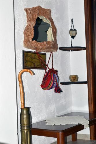 a room with a table and a mirror on a wall at Katerina Apartments in Káto Zákros