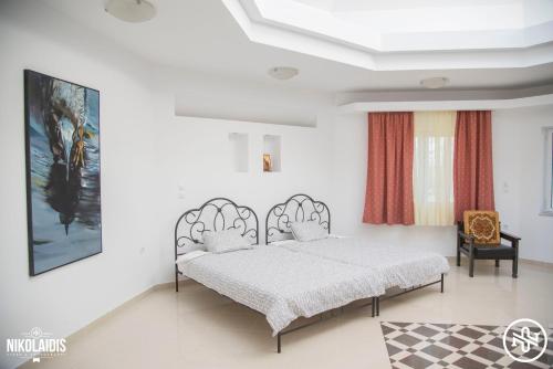 a bedroom with a bed in a room at Villa Alba in Preveza