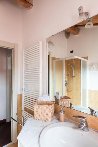 a bathroom with a sink and a mirror at Residenza Santa Cecilia in San Vincenzo
