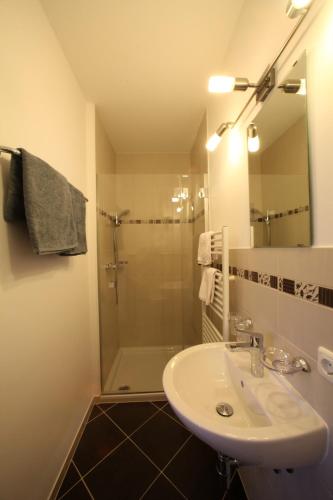 a bathroom with a sink and a shower at Ferienhaus Viktoria in Abfaltersbach