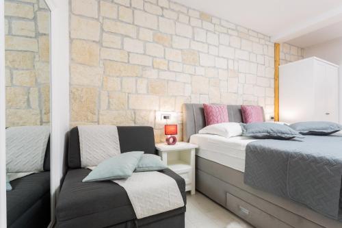 Posteľ alebo postele v izbe v ubytovaní Apartman Arbol