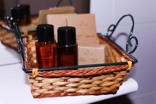 a basket with bottles of essential oils on a table at Il Palazzo Ridracoli in Bagno di Romagna