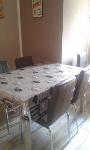 a dining room table with chairs around it at Appartamento Sophia in Collegno