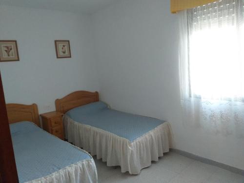 מיטה או מיטות בחדר ב-Chalet Jose