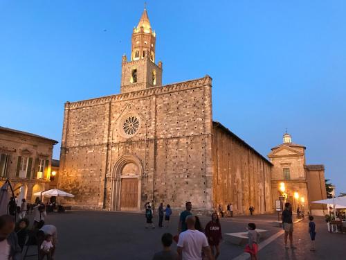 an old building with a clock tower on top of it at Panfilo Farmhouse in Cellino Attanasio