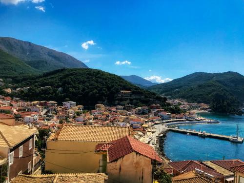 a view of a town with a river and mountains at Marthas Studios in Parga