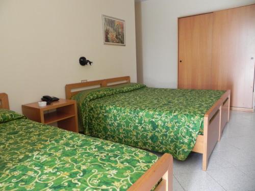 Giường trong phòng chung tại Albergo Sant'Anna