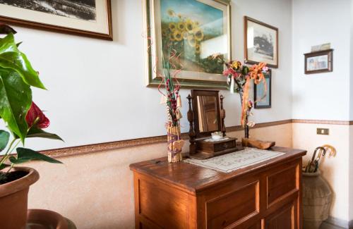 a room with a wooden table with a telephone on it at La Piaggia in Assisi