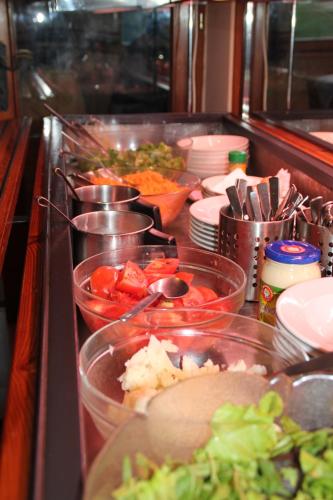 a kitchen with many bowls of food on a counter at Schlossberg in San Leonardo in Passiria
