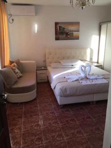 Ένα ή περισσότερα κρεβάτια σε δωμάτιο στο Apartments Gusar