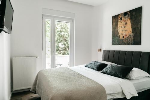 Postel nebo postele na pokoji v ubytování Nu-Apartments