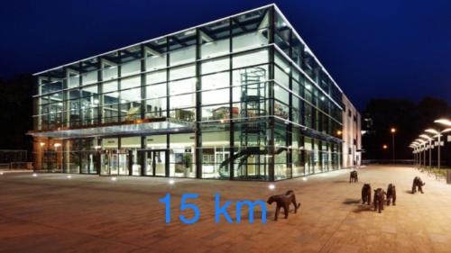 a large glass building with horses in front of it at Penzion Úpice Luky in Úpice
