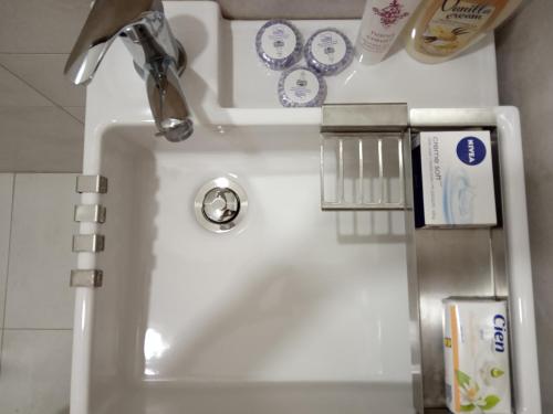 a bathroom sink with a faucet and a sink at Studio Jasna in Novi Sad