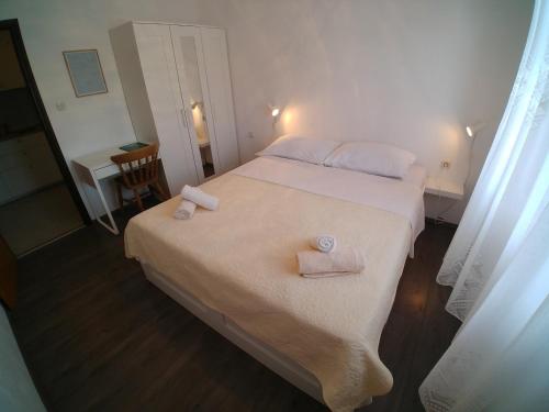Ένα ή περισσότερα κρεβάτια σε δωμάτιο στο Apartmani Sali Seaview