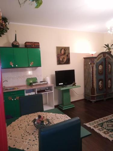 a living room with a desk and a computer in it at Vila Kraljica in Vrdnik