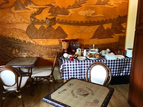 a dining room with a table and a table and chairs at Treviso Rooms in Treviso