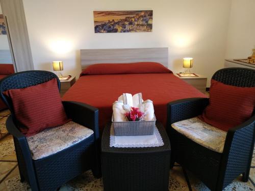 Un pat sau paturi într-o cameră la Casa Donna Franca
