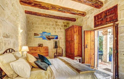 Una cama o camas en una habitación de Il Kiostro