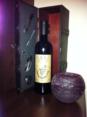 a bottle of wine sitting next to a container at Hotel Gerber in Hösbach
