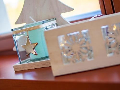 a wooden box with a star in it on a table at Penzion Pastouška s pohostinstvím in Moravský Krumlov
