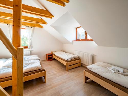 Postel nebo postele na pokoji v ubytování Penzion Pastouška s pohostinstvím