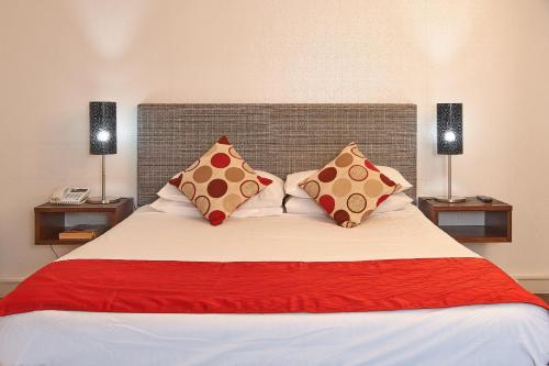 Ένα ή περισσότερα κρεβάτια σε δωμάτιο στο Hotel Carlton Mill