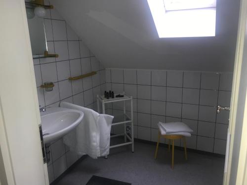 a bathroom with a sink and a mirror and a window at il castello in Haiming