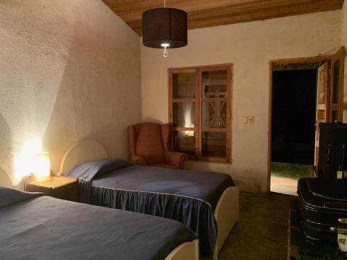Llit o llits en una habitació de Sitio proximo a SP lareira campinho e jacuzzi