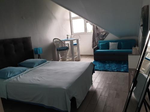 Säng eller sängar i ett rum på Les Eaux Turquoises Aux Gosier
