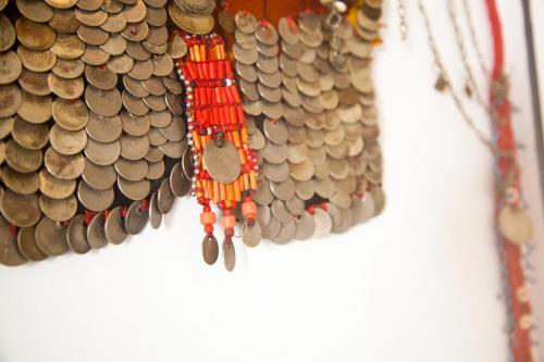 a bunch of beads hanging on a wall at Red C Villas in Dahab