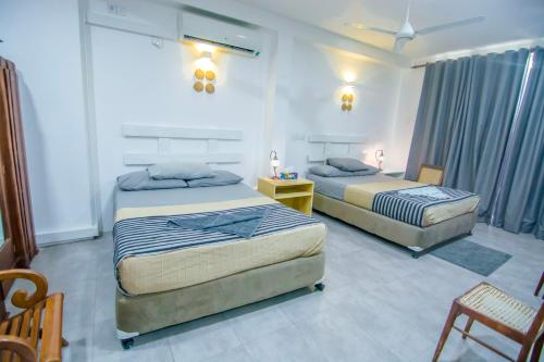 Un pat sau paturi într-o cameră la Seeya's Villa, your Home away from Home