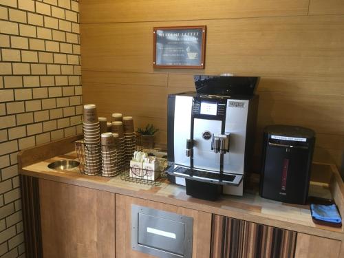a coffee machine sitting on top of a counter at Tabist THE GREEN OTARU in Otaru