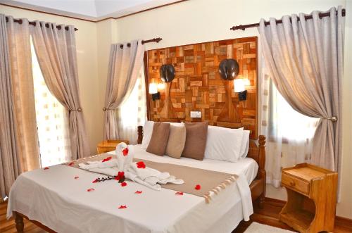 Postel nebo postele na pokoji v ubytování Calou Guest House